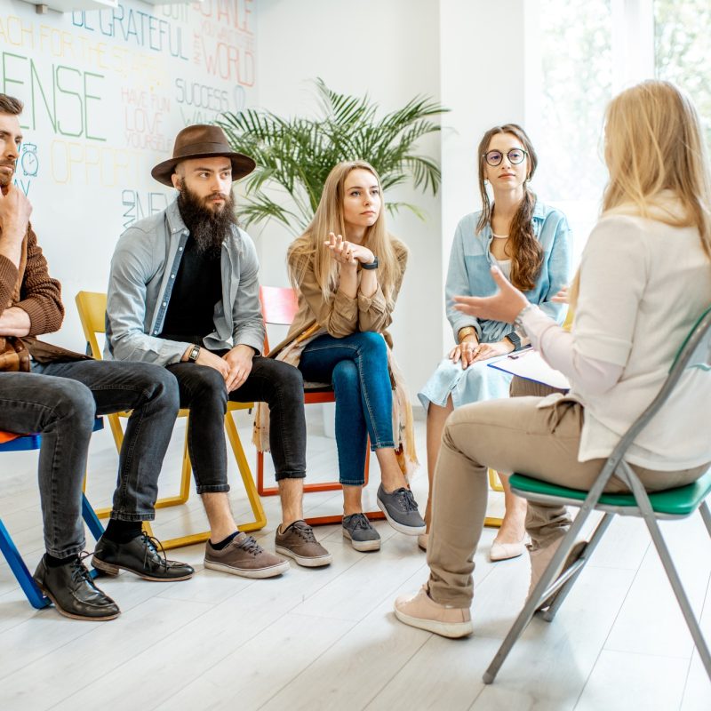 Group of people during the psychological therapy indoors