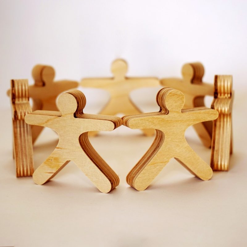 Teammates hold hands to support small business in difficult times